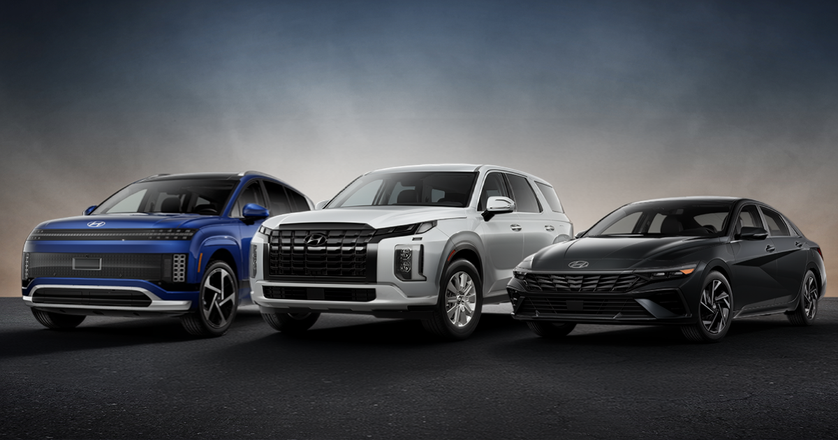 A model lineup of Hyundai vehicles, including the Kona SUV on the left, the Palisade SUV in the center, and the Elantra sedan